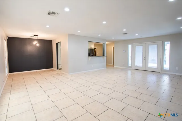 a view of an empty room and window