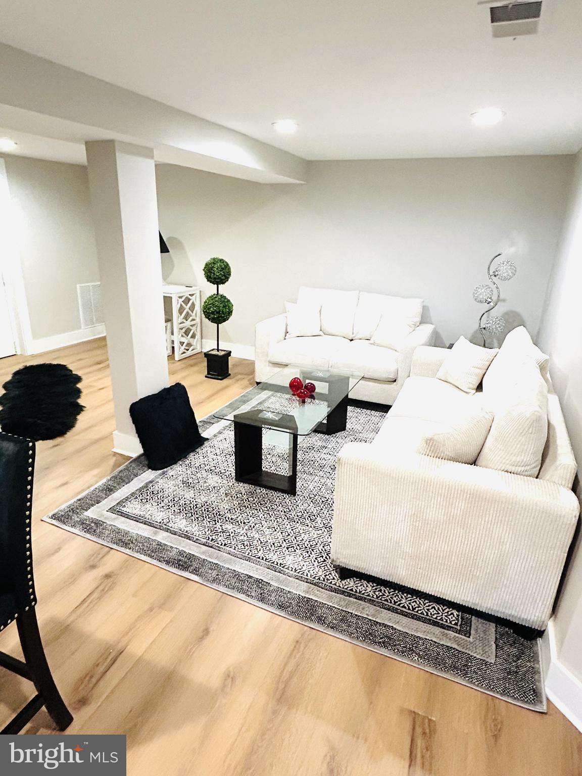 1516 Hamilton Street Northwest Washington, DC 20011 - Photo 4 of 14 a living room with furniture and a couch