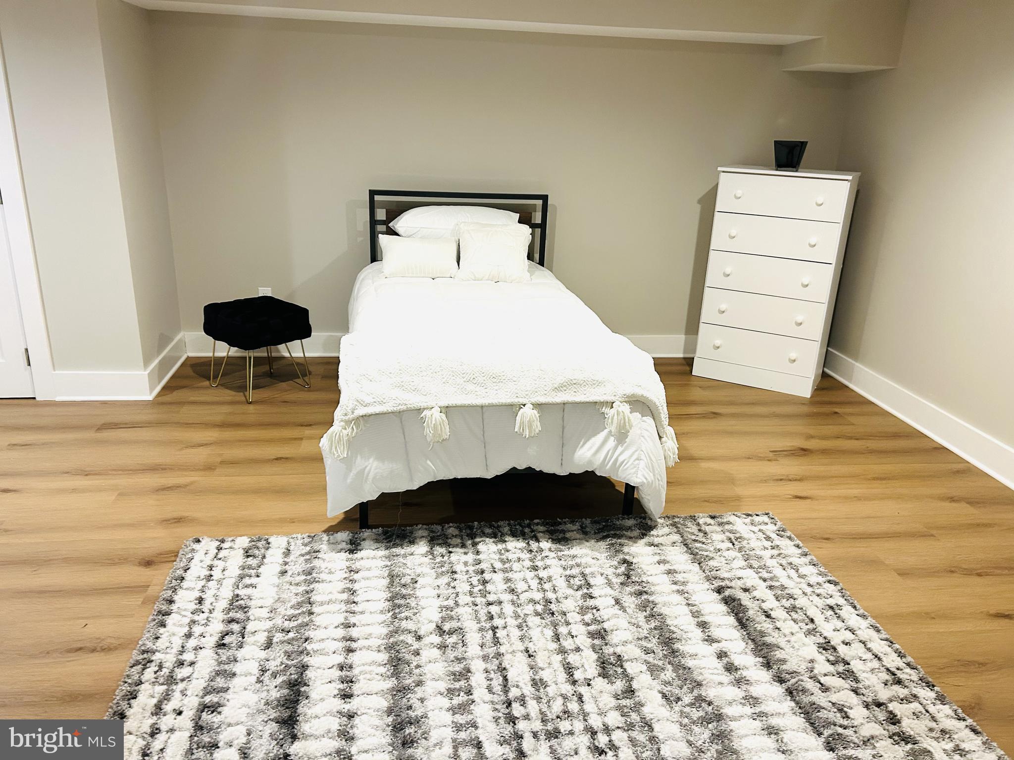 1516 Hamilton Street Northwest Washington, DC 20011 - Photo 8 of 14 a bedroom with a bed and a walk in closet