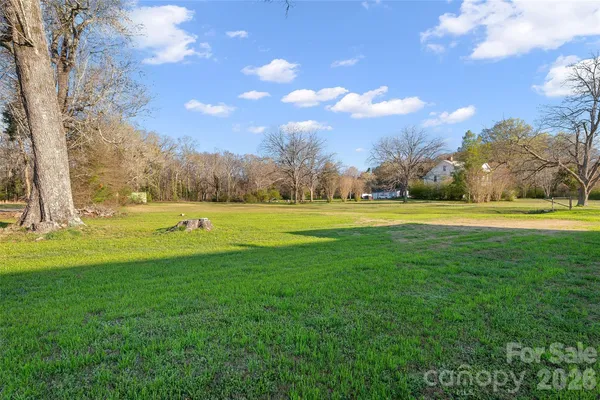 a view of a house with a big yard