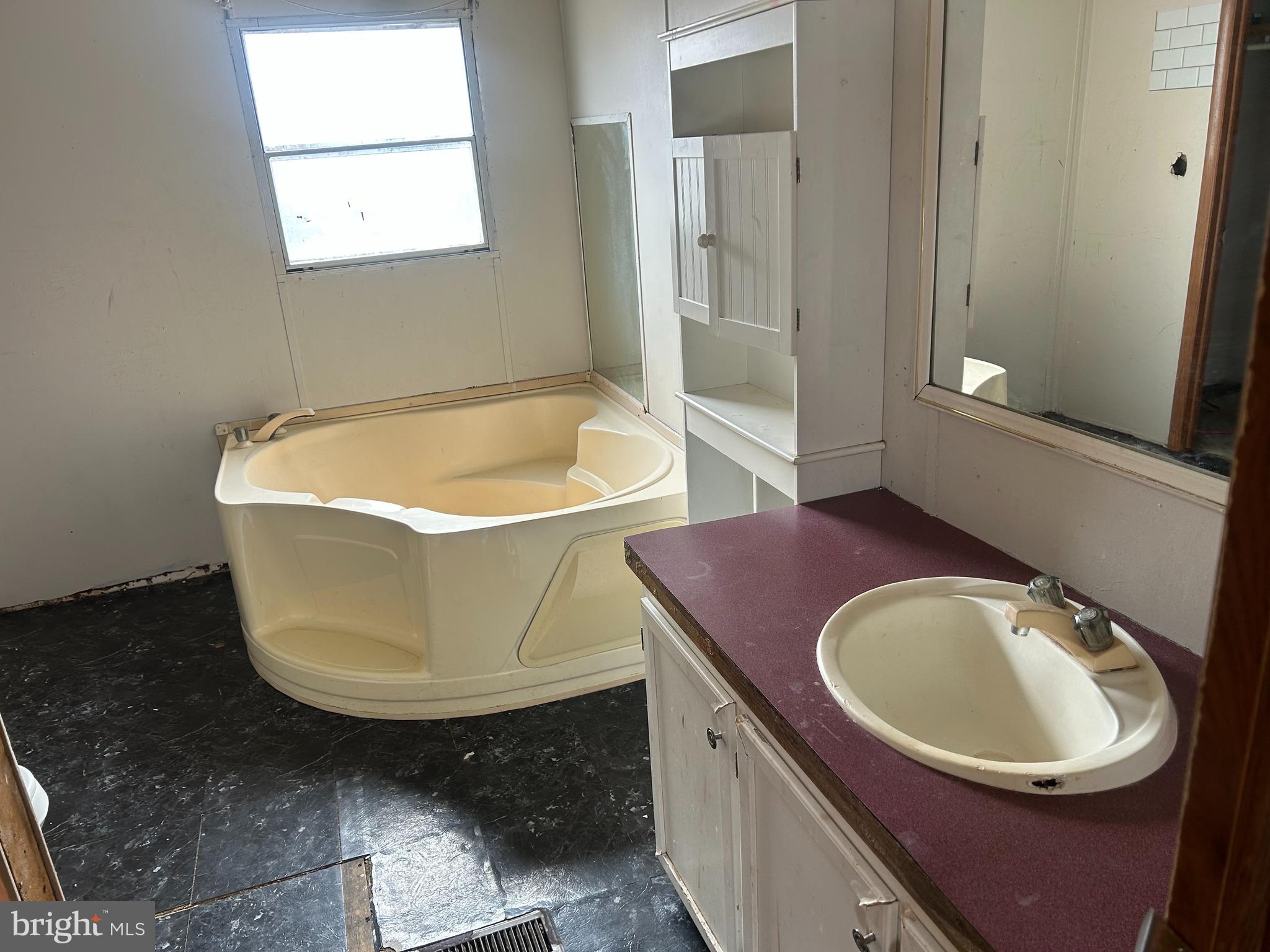 47 Evidence Road, Unit 231 Magnolia, DE 19962 - Photo 11 of 19 a bath tub sitting in a bathroom