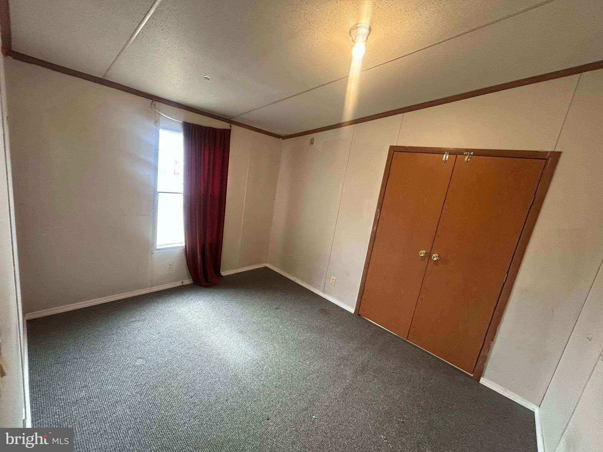 47 Evidence Road, Unit 231 Magnolia, DE 19962 - Photo 15 of 19 an empty room with windows and closet