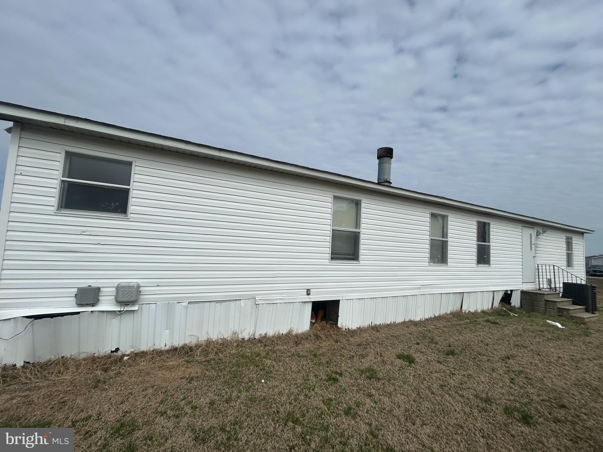47 Evidence Road, Unit 231 Magnolia, DE 19962 - Photo 16 of 19 a view of a house with backyard