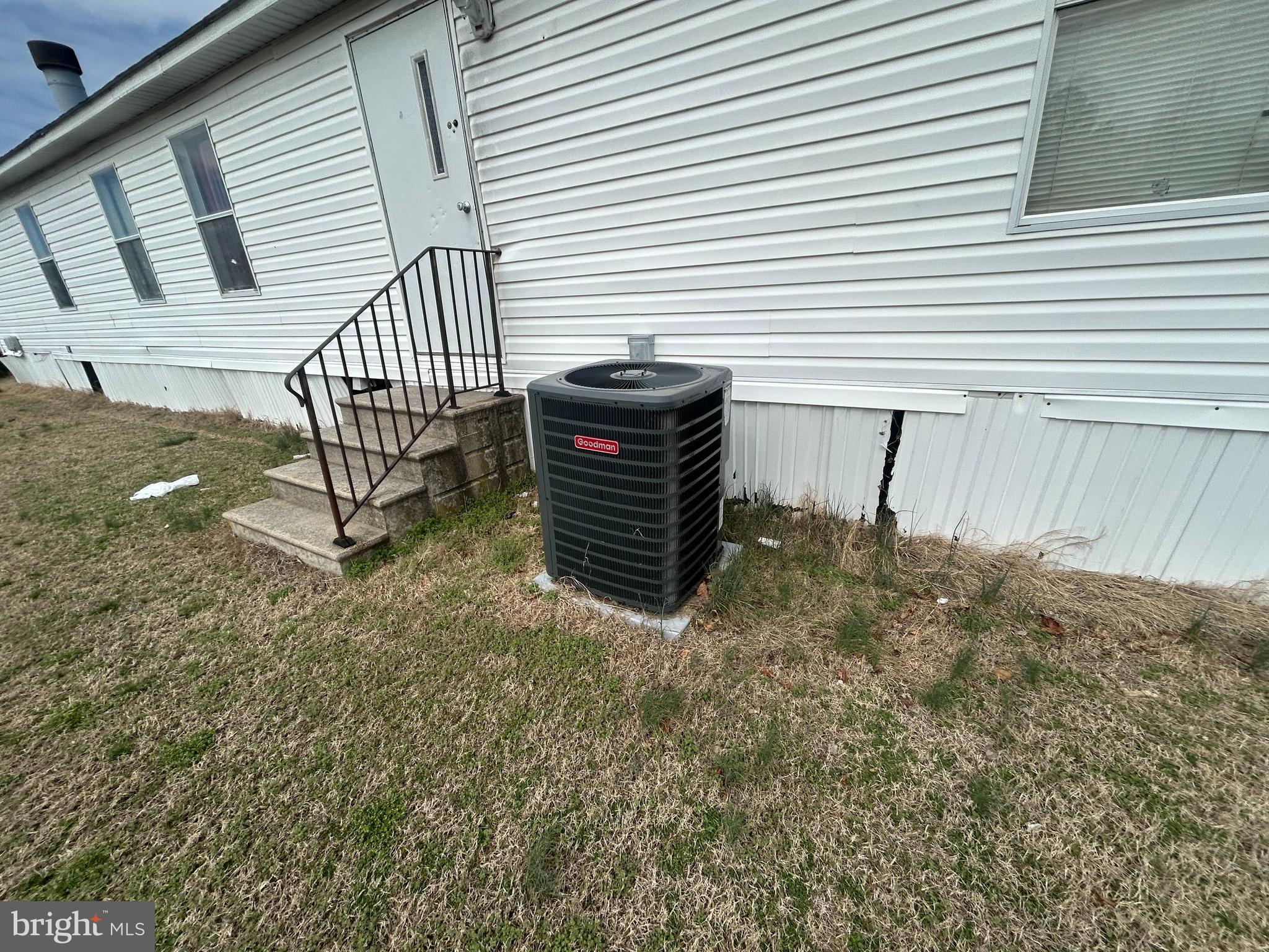 47 Evidence Road, Unit 231 Magnolia, DE 19962 - Photo 18 of 19 a view of a porch with a bench