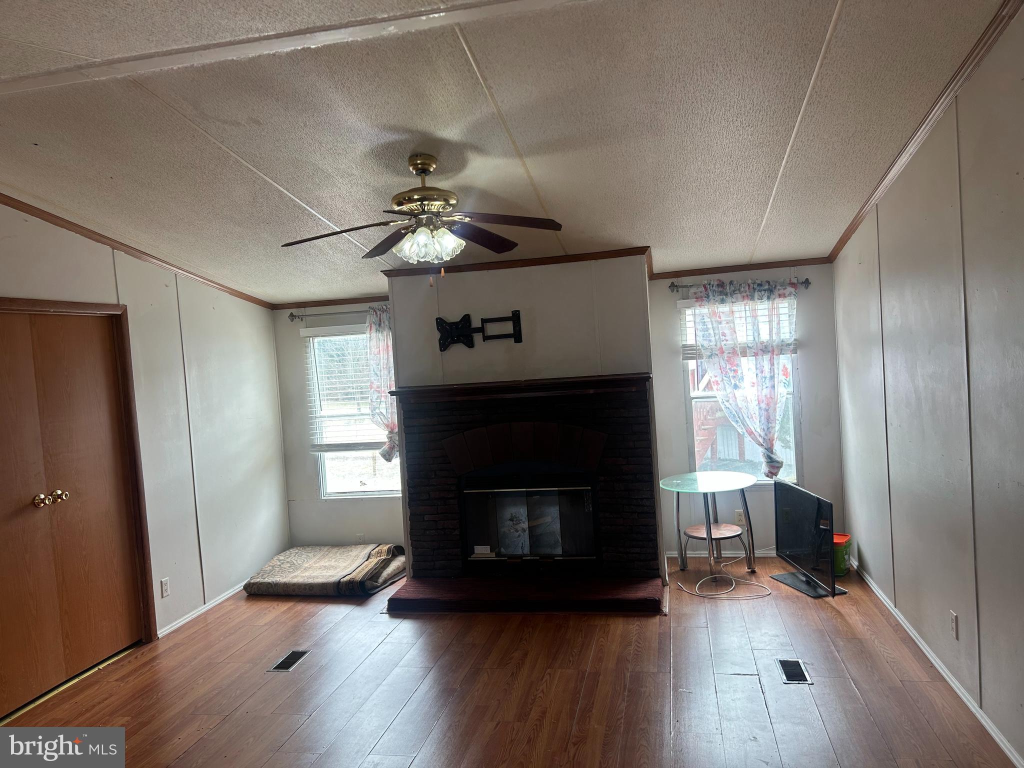 47 Evidence Road, Unit 231 Magnolia, DE 19962 - Photo 2 of 19 a living room with furniture and a fireplace