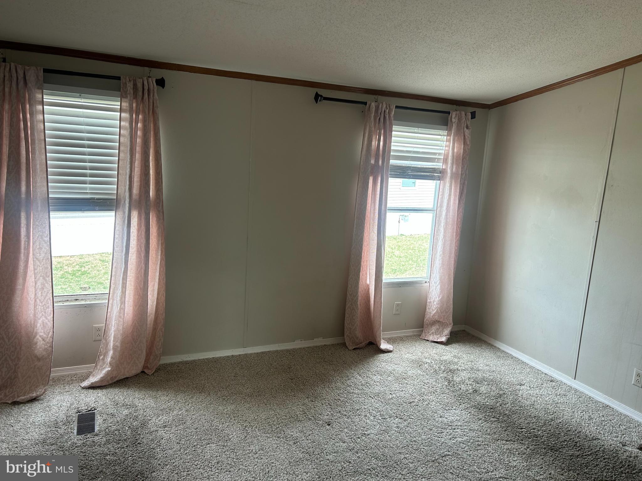 47 Evidence Road, Unit 231 Magnolia, DE 19962 - Photo 9 of 19 a view of an empty room with a window