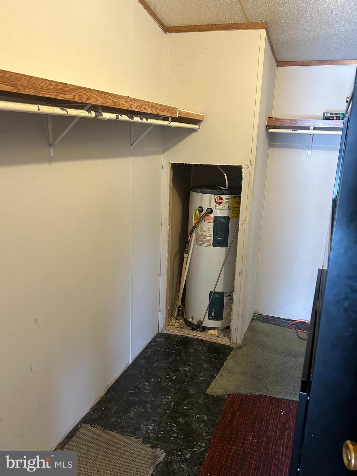 47 Evidence Road, Unit 231 Magnolia, DE 19962 - Photo 10 of 19 a view of a room with rack and wooden floor