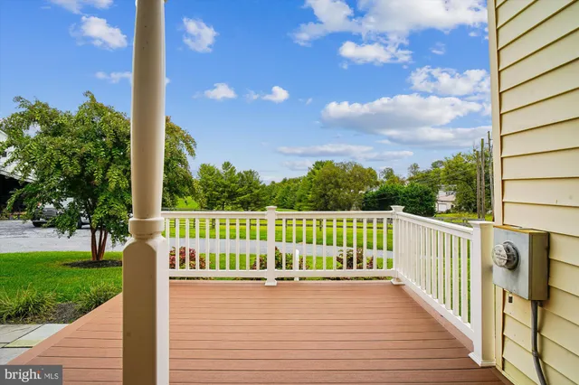a view of a deck with a big yard