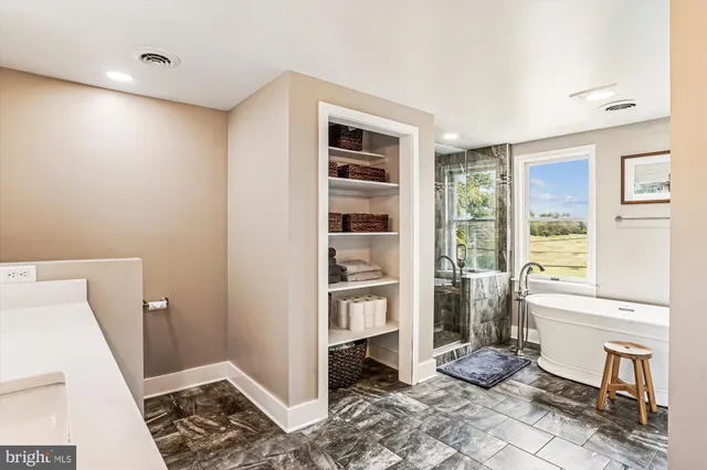 a living room with a furniture and a rug
