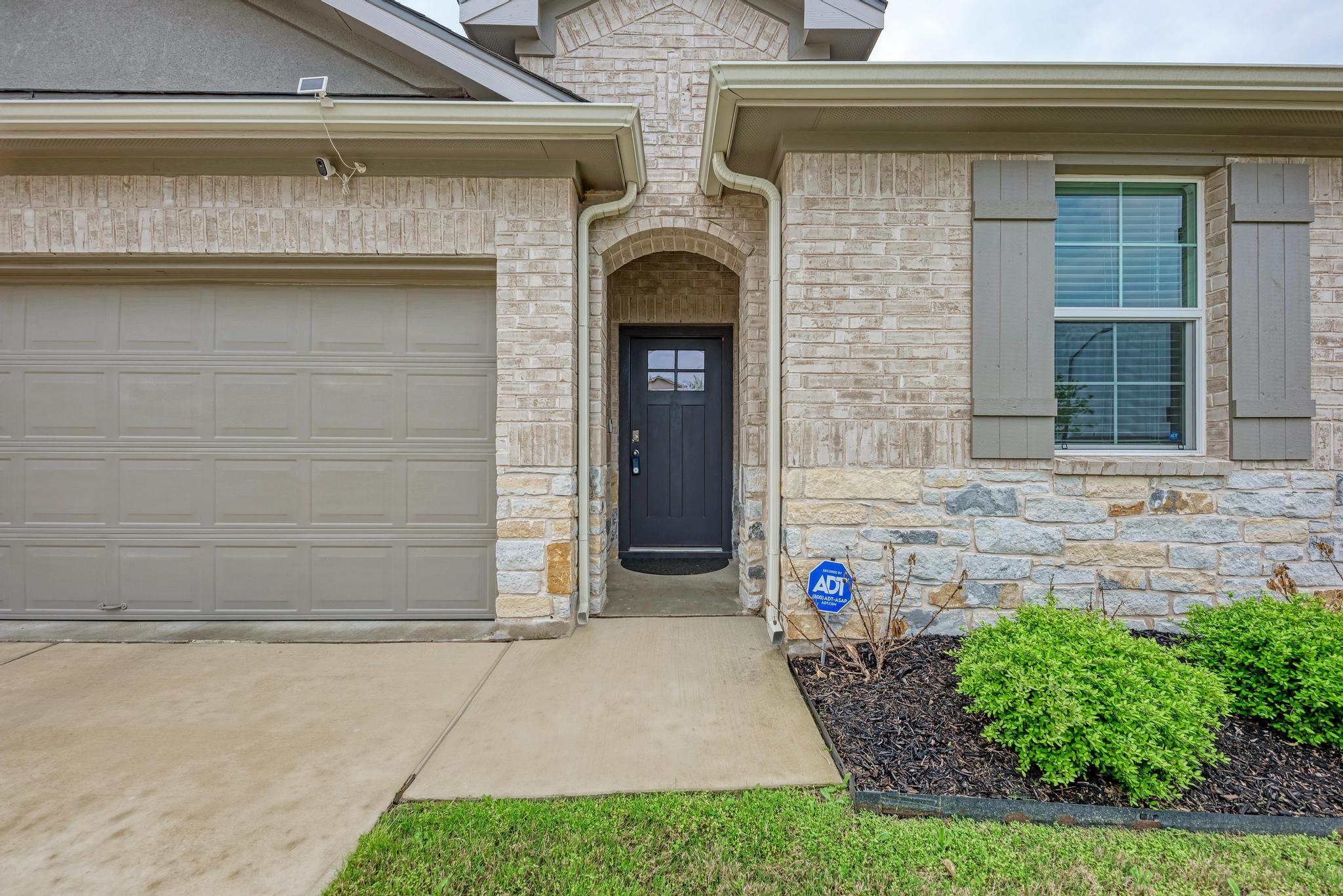 208 Abby Road Georgetown, TX 78626 - Photo 11 of 40 a front view of a house with garden
