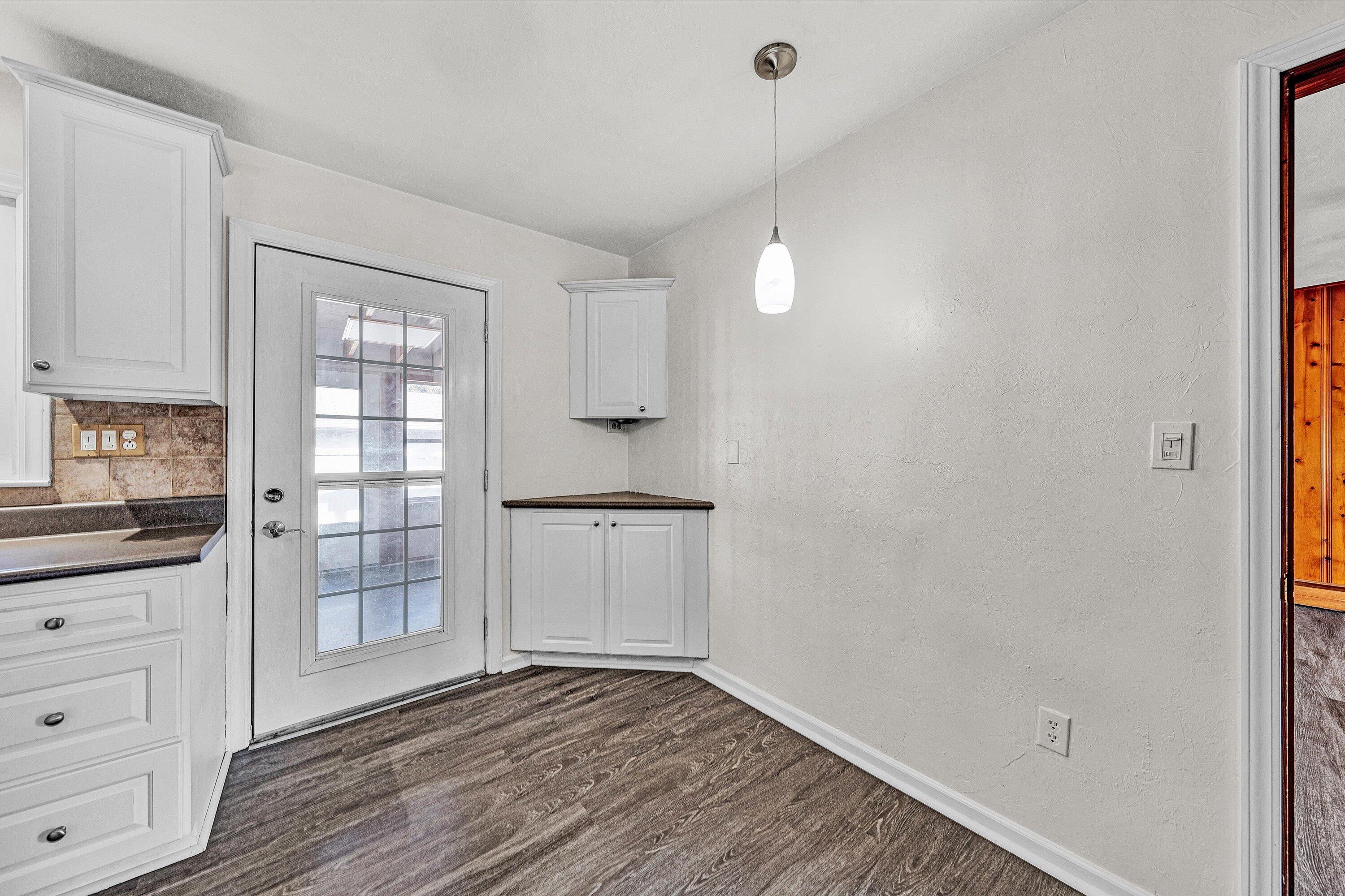 1944 Blue Ridge Springs Road Blue Ridge, VA 24064 - Photo 19 of 60 a view of an empty room with window and wooden floor