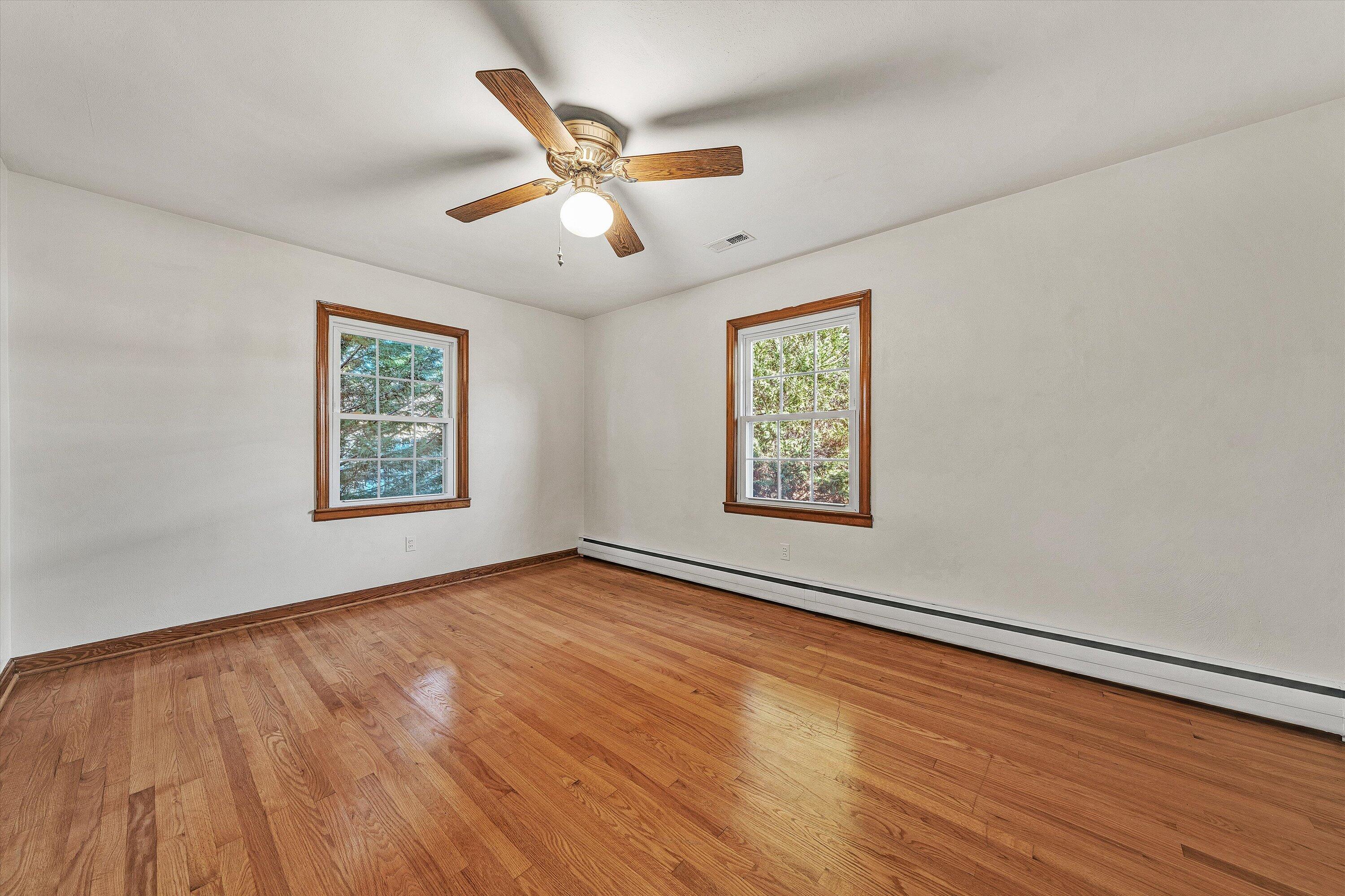 1944 Blue Ridge Springs Road Blue Ridge, VA 24064 - Photo 26 of 60 a view of an empty room with wooden floor and a window