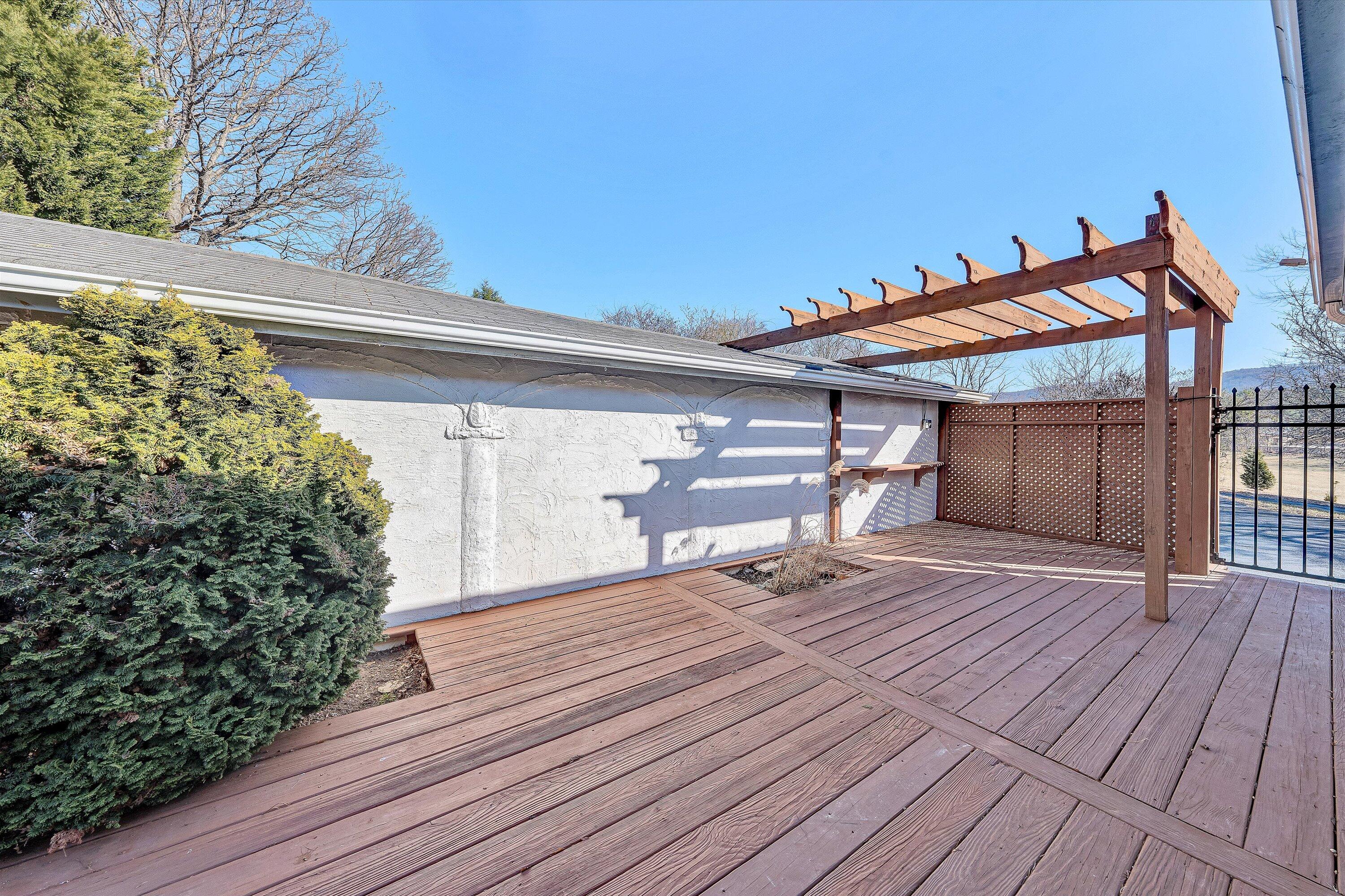 1944 Blue Ridge Springs Road Blue Ridge, VA 24064 - Photo 34 of 60 a wooden bench sitting on top of a wooden deck