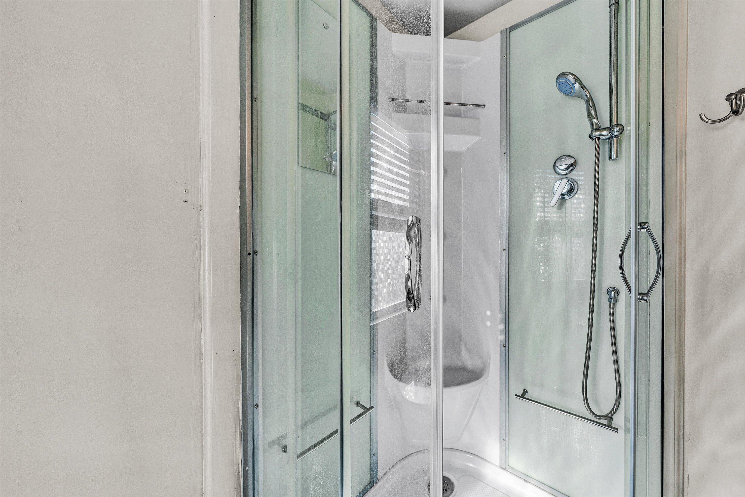 1944 Blue Ridge Springs Road Blue Ridge, VA 24064 - Photo 48 of 60 a bathroom with a glass shower door