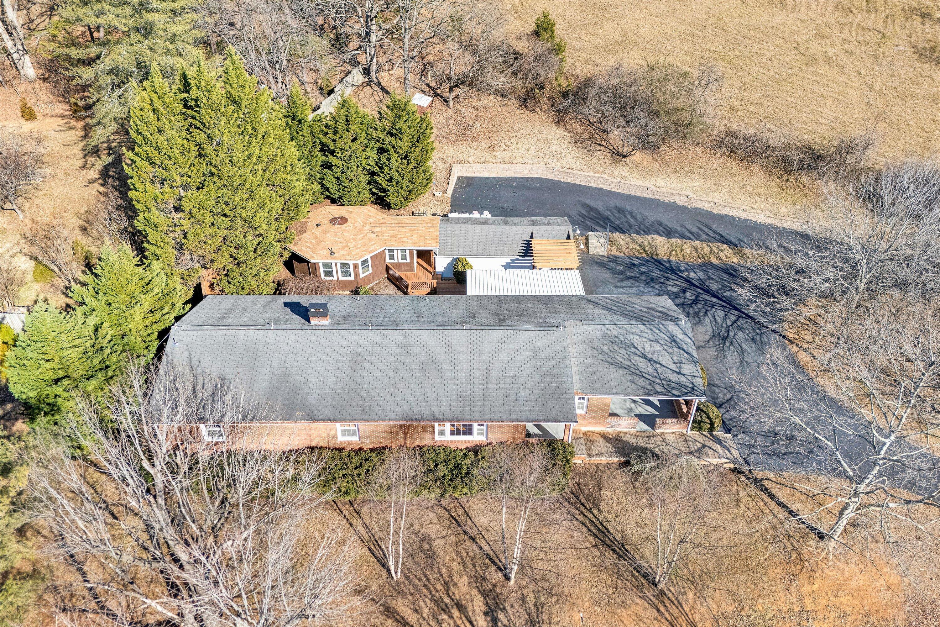 1944 Blue Ridge Springs Road Blue Ridge, VA 24064 - Photo 5 of 60 a view of a backyard with plants and a lake view