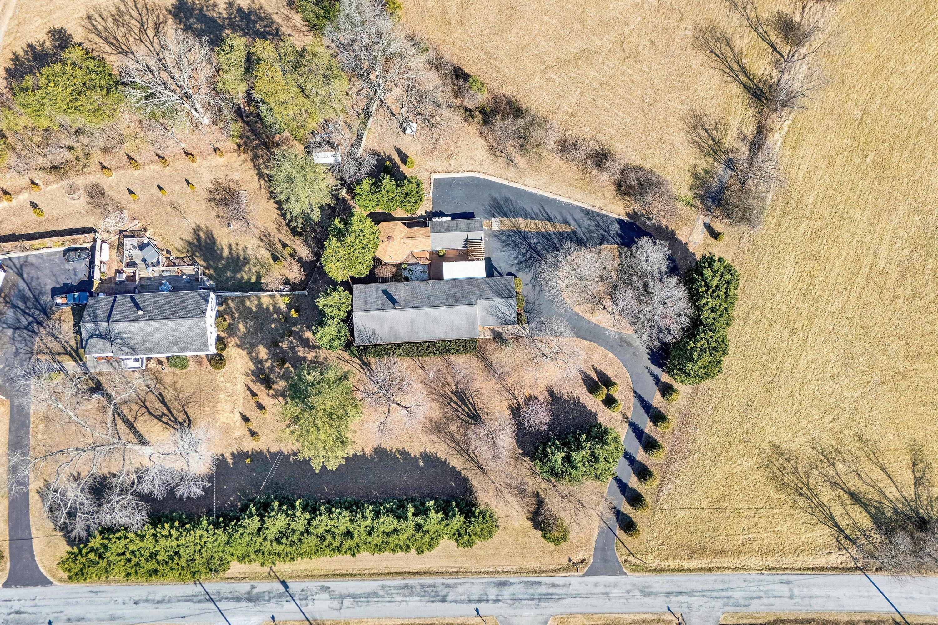 1944 Blue Ridge Springs Road Blue Ridge, VA 24064 - Photo 57 of 60 an aerial view of a house with a yard