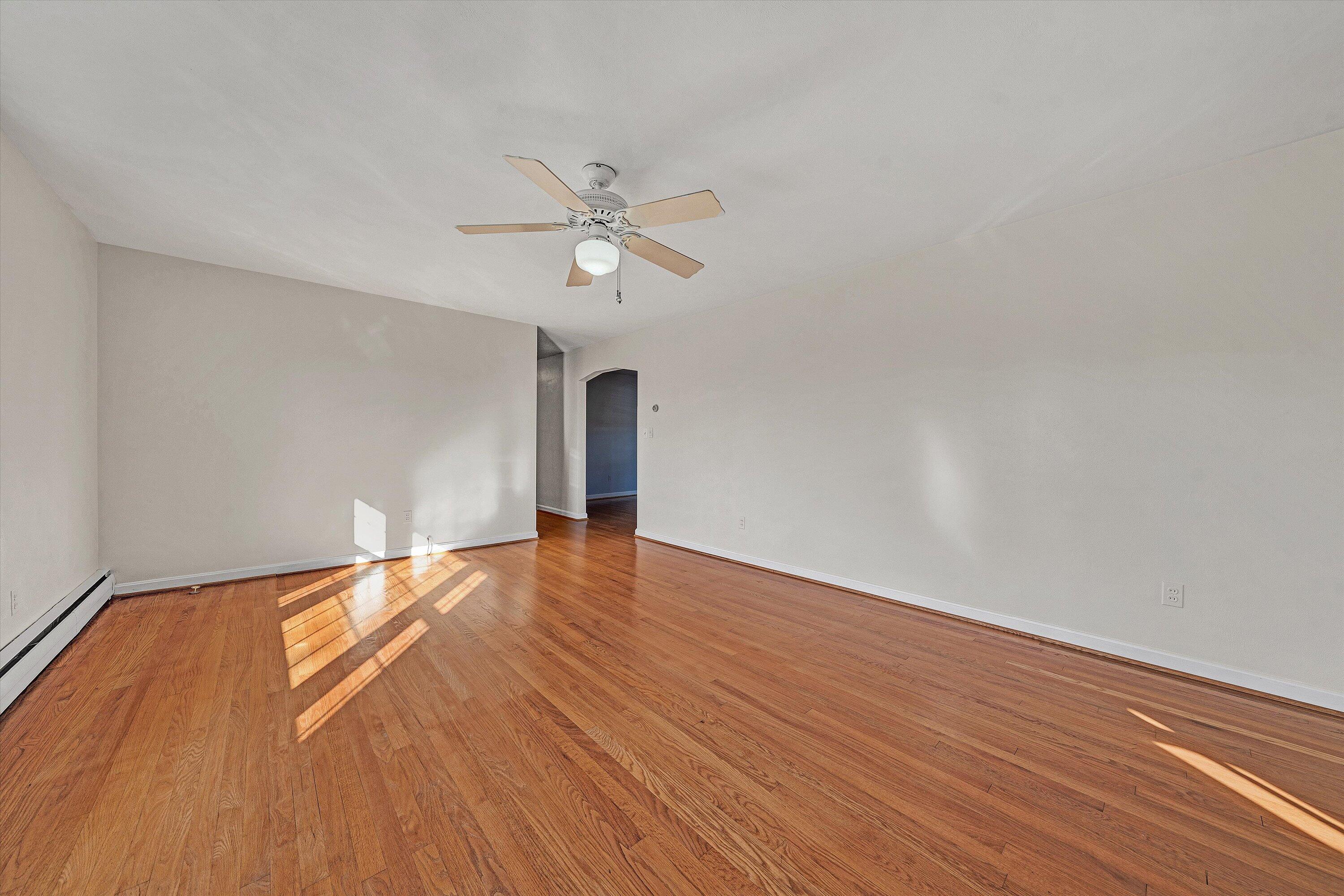 1944 Blue Ridge Springs Road Blue Ridge, VA 24064 - Photo 10 of 60 a view of empty room with wooden floor and fan