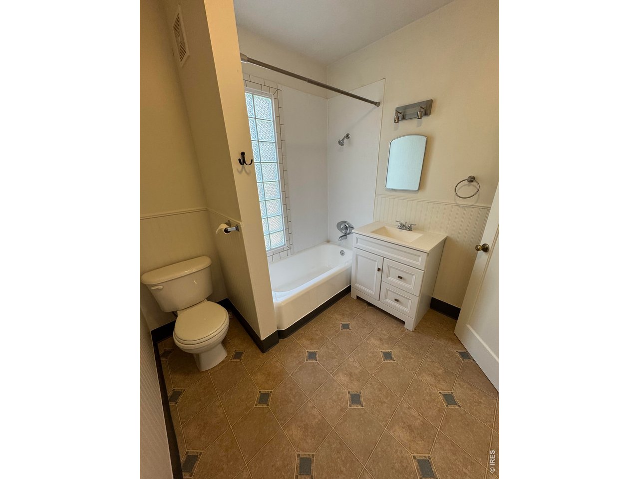 612 South Howes Street Fort Collins, CO 80521 - Photo 9 of 18 a spacious bathroom with a toilet a sink and shower
