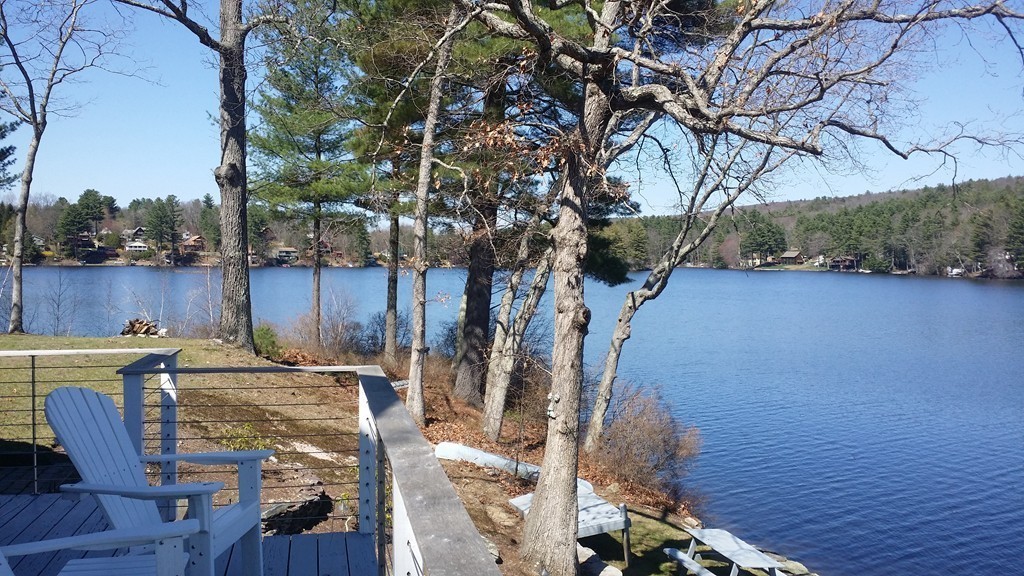 19 Pointview Road Ware, MA 01082 - Photo 5 of 19 a view of a patio with table and chairs with wooden floor and fence