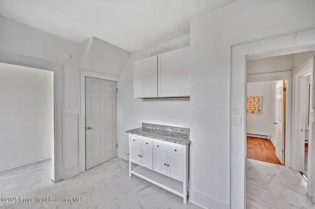 a view of cabinets with wooden floor