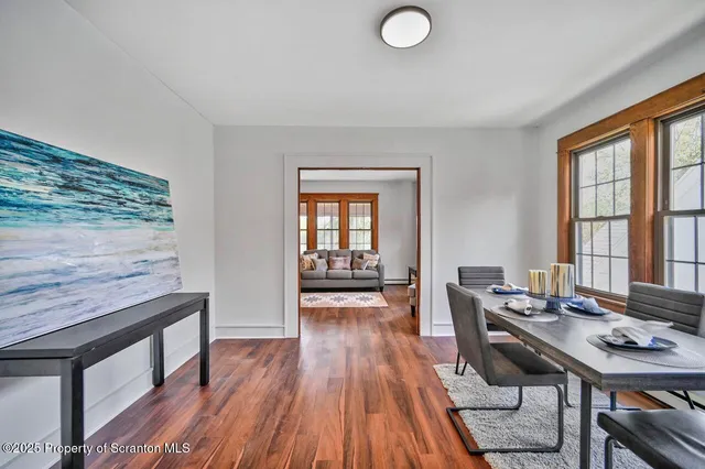 a view of a dining room with furniture and window