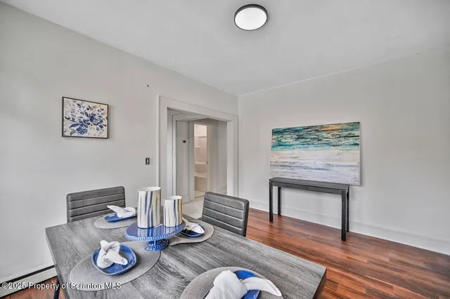 a living room with furniture a rug and a fireplace
