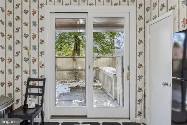 a view of a bathroom with a glass door and a window
