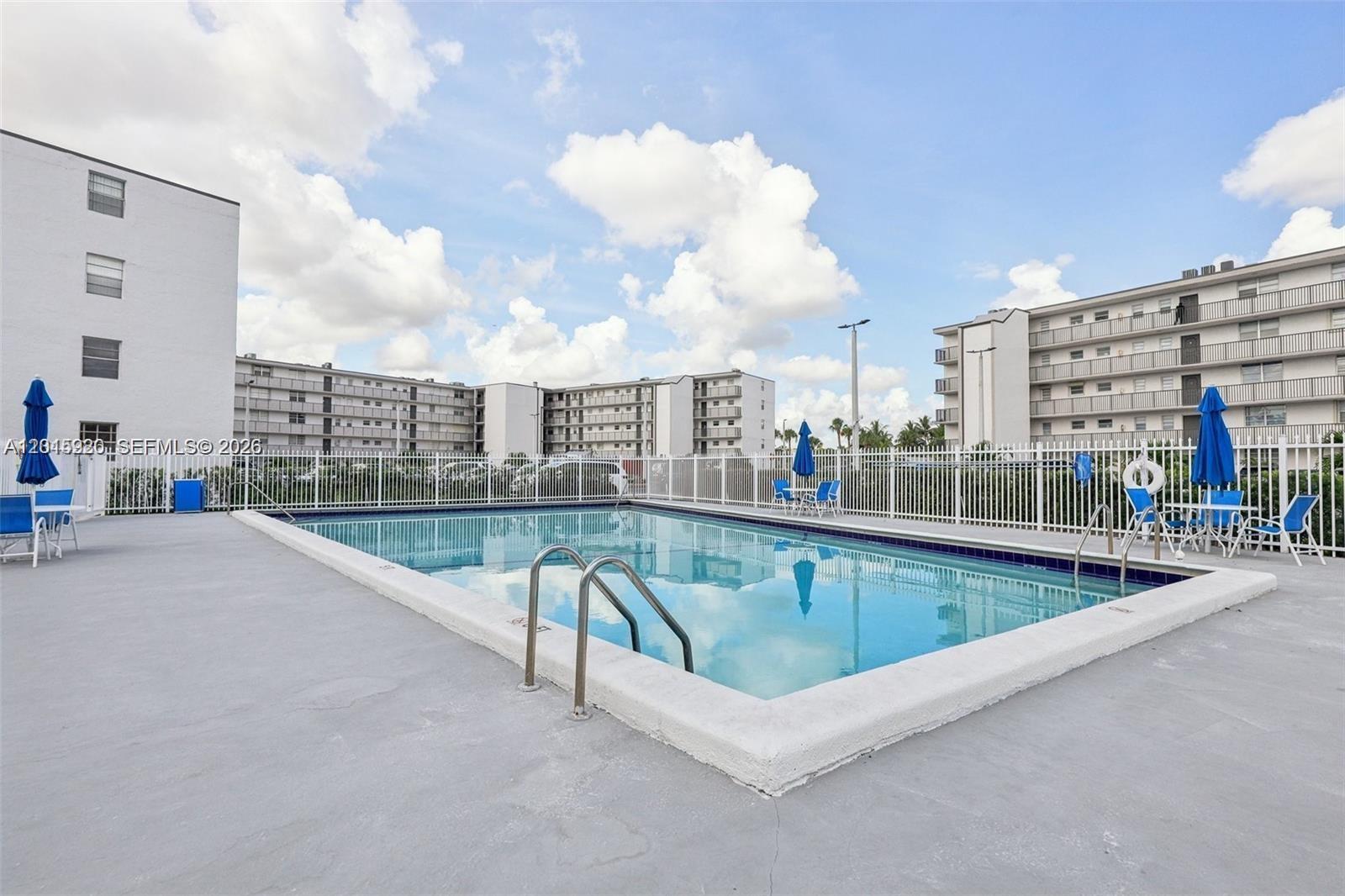 14170 Southwest 84th Street, Unit 404F Miami, FL 33183 - Photo 13 of 18 a view of a swimming pool with a terrace