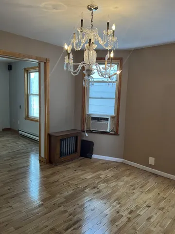a view of a livingroom with wooden floor