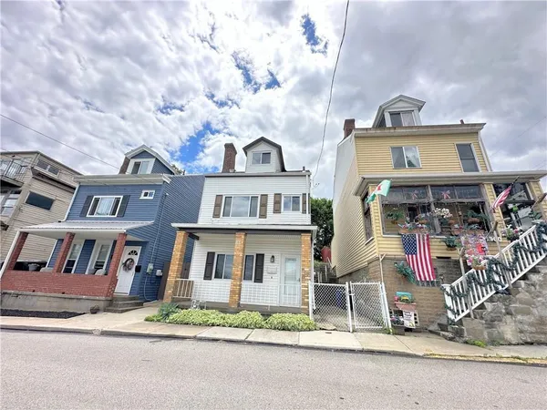 a front view of a houses on the street