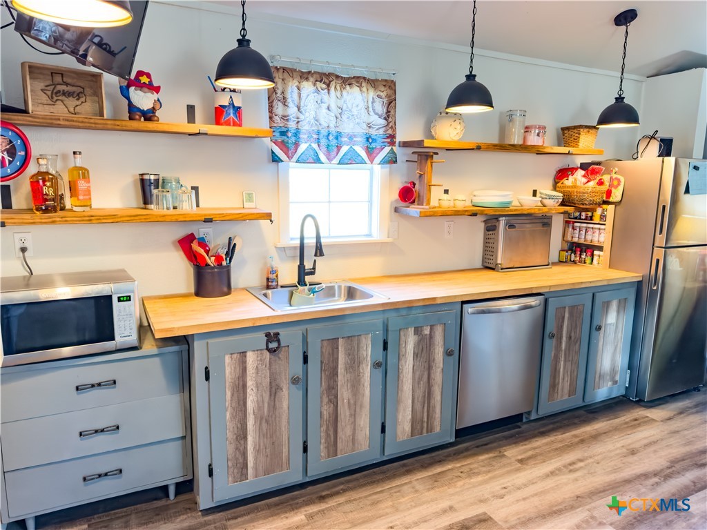 1374 Bego Road Goliad, TX 77963 - Photo 44 of 44 Lovely wood finish and rustic lighting features!