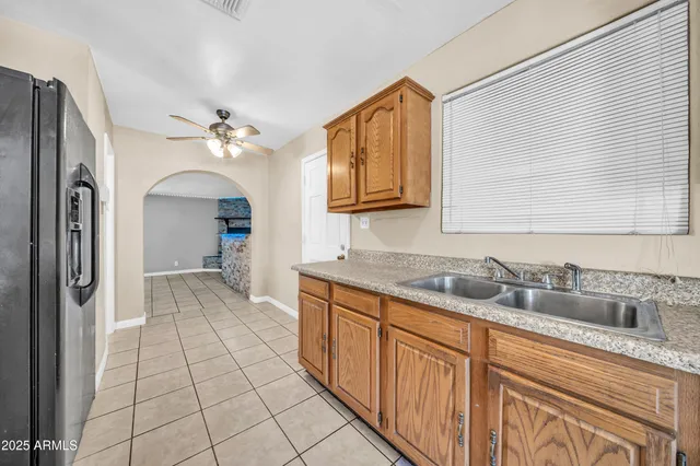 a kitchen with stainless steel appliances granite countertop a stove and a sink