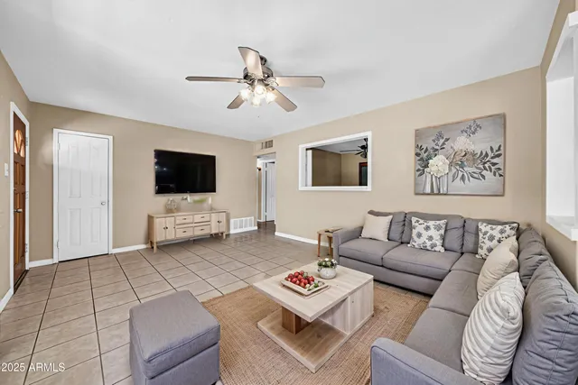 a spacious bedroom with a bed and a window