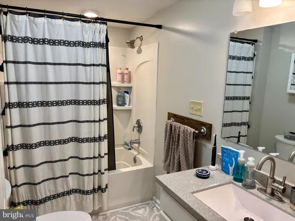 a bathroom with a sink and a shower