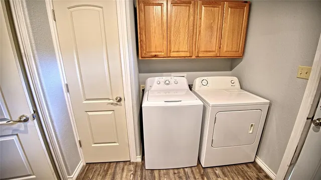 a view of bathroom with a washer and dryer