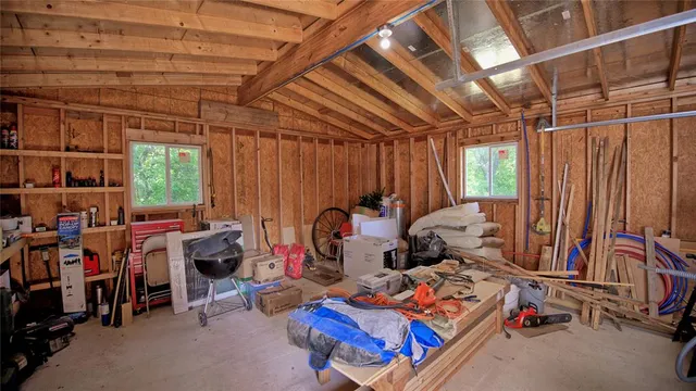 a storage room with lots of furniture and clutter