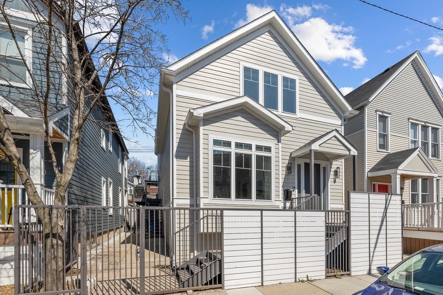 1226 West Draper Street Chicago, IL 60614 - Photo 1 of 28 a view of a white house with large windows