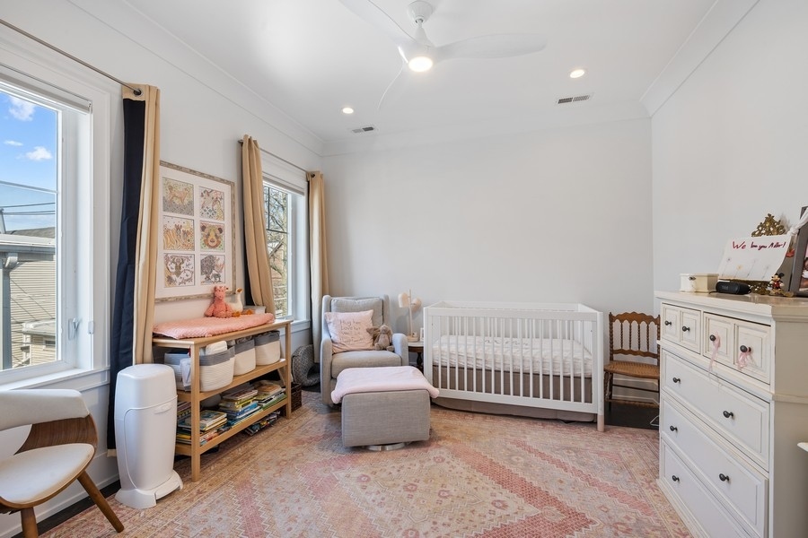 1226 West Draper Street Chicago, IL 60614 - Photo 14 of 28 a bedroom with furniture and a window