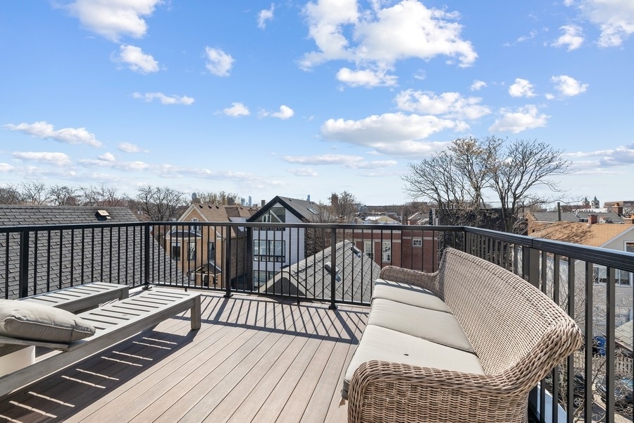 1226 West Draper Street Chicago, IL 60614 - Photo 18 of 28 a view of a balcony with wooden floor