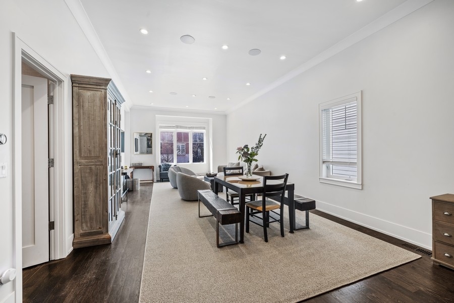 1226 West Draper Street Chicago, IL 60614 - Photo 4 of 28 a view of a dining room with furniture and wooden floor