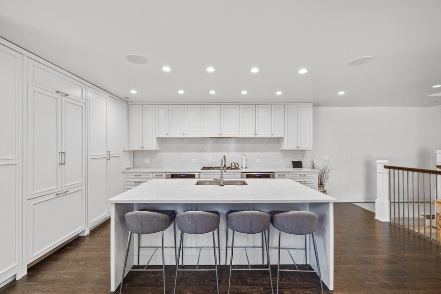 1226 West Draper Street Chicago, IL 60614 - Photo 9 of 28 a kitchen with a dining table chairs and wooden floor