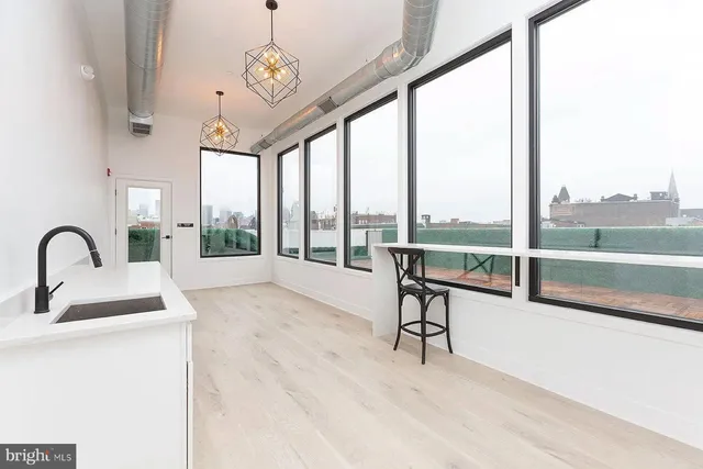 a view of a room with balcony and furniture