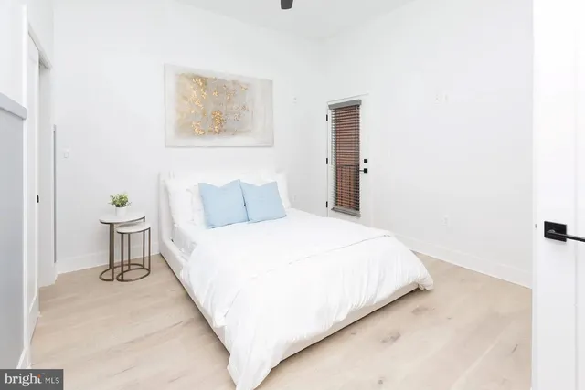 a bedroom with a bed and a table