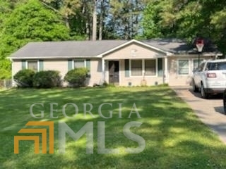25 Nugget Drive Villa Rica, GA 30180 - Photo 1 of 1 a front view of a house with a garden