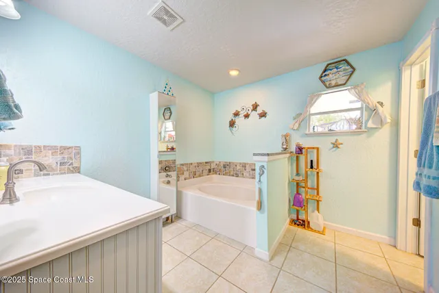 a bedroom with a bed and a table in it