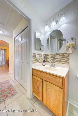 a bathroom with a double vanity sink mirror and