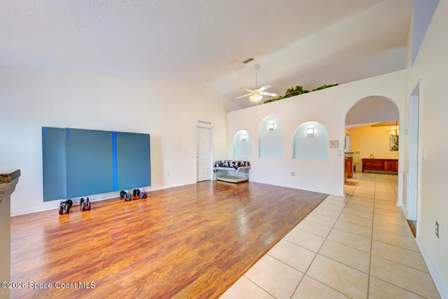 a view of a room with a sink and cabinets