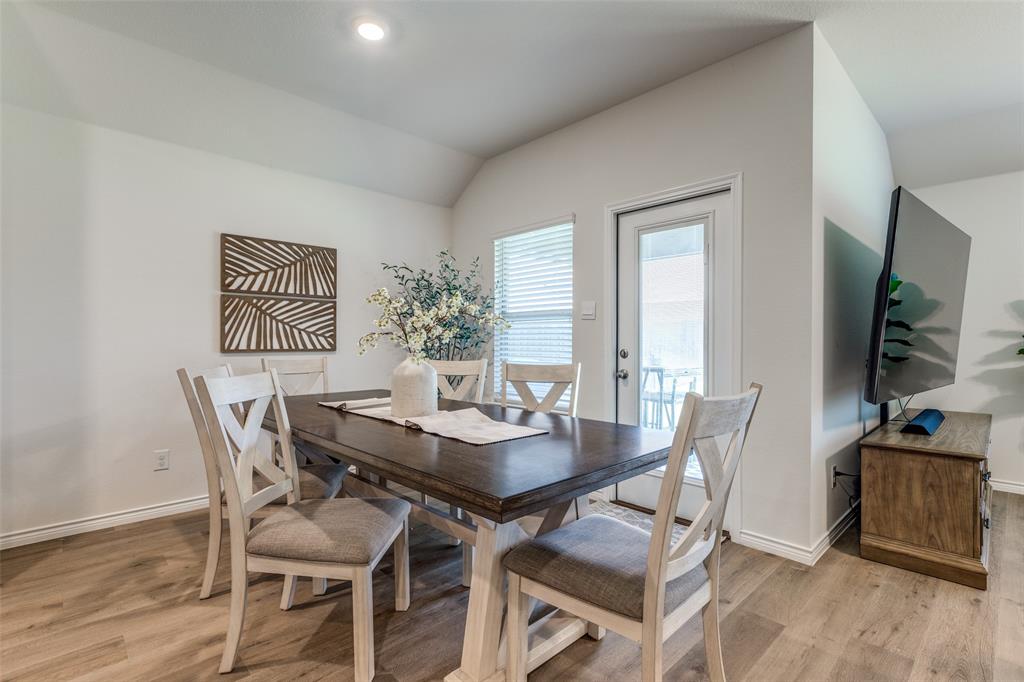 708 Cool Cyn Trail Princeton, TX 75407 - Photo 14 of 28 a dining room with furniture and wooden floor