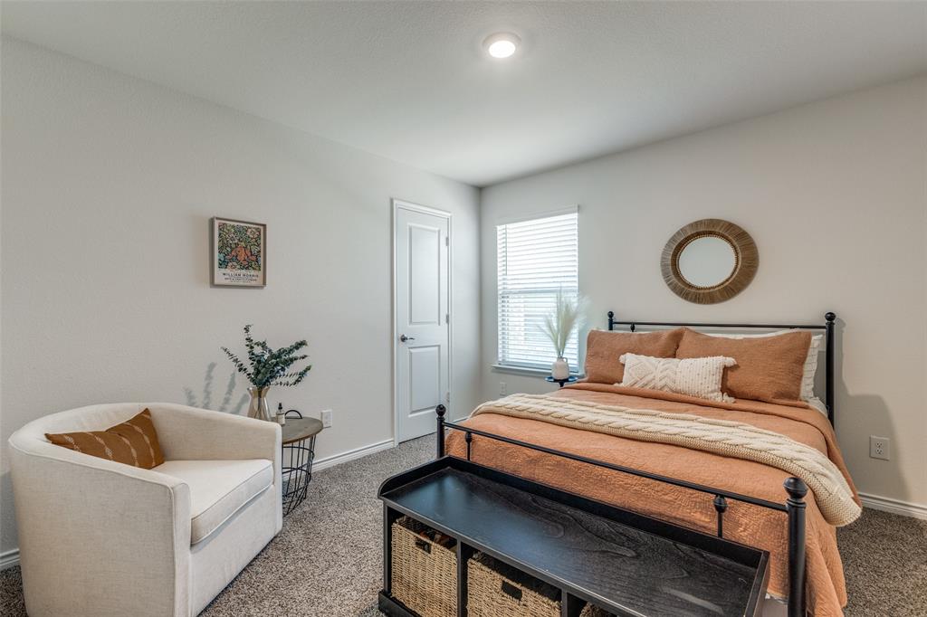 708 Cool Cyn Trail Princeton, TX 75407 - Photo 17 of 28 a bedroom with a bed and window