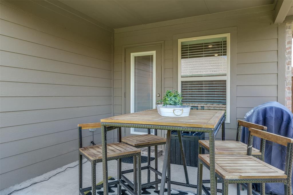 708 Cool Cyn Trail Princeton, TX 75407 - Photo 24 of 28 a view of a table and chairs in patio
